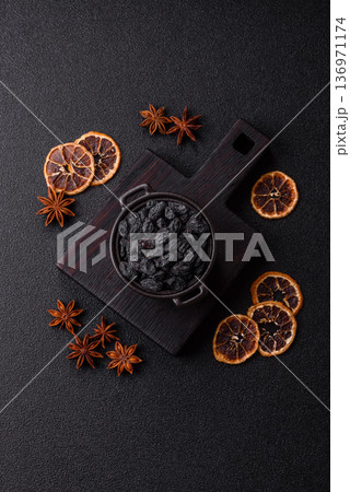 Sweet, dry black or blue raisins made from grapes are a healthy and nutritious food. Black raisins 136971174