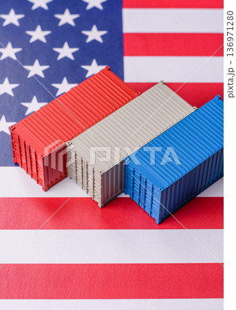 Cargo containers on the US flag as a conceptual backdrop for goods export and logistics. Cargo containers Cargo containers on the US flag as a conceptual backdrop for goods export and logistics. Cargo containers 136971280