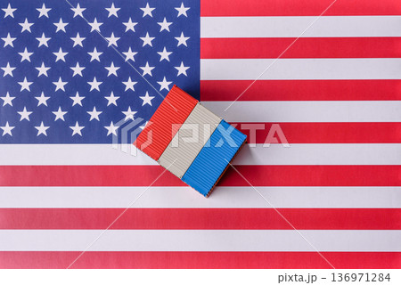 Cargo containers on the US flag as a conceptual backdrop for goods export and logistics. Cargo containers Cargo containers on the US flag as a conceptual backdrop for goods export and logistics. Cargo containers 136971284