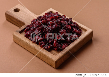 Dried sweet cranberries, natural berries for a healthy diet. Dried cranberries Dried sweet cranberries, natural berries for a healthy diet. Dried cranberries 136971333
