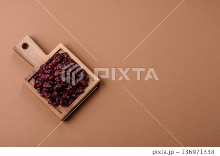 Dried sweet cranberries, natural berries for a healthy diet. Dried cranberries Dried sweet cranberries, natural berries for a healthy diet. Dried cranberries 136971338