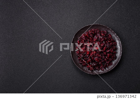 Dried sweet cranberries, natural berries for a healthy diet. Dried cranberries Dried sweet cranberries, natural berries for a healthy diet. Dried cranberries 136971342