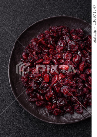 Dried sweet cranberries, natural berries for a healthy diet. Dried cranberries Dried sweet cranberries, natural berries for a healthy diet. Dried cranberries 136971347