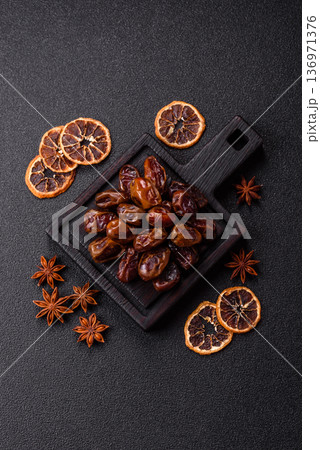 Dried sweet dates, natural tropical fruits for a healthy diet. Dried dates Dried sweet dates, natural tropical fruits for a healthy diet. Dried dates 136971376