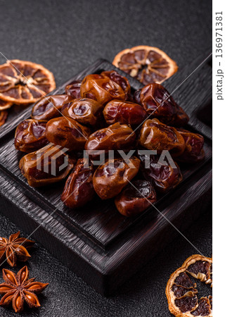Dried sweet dates, natural tropical fruits for a healthy diet. Dried dates Dried sweet dates, natural tropical fruits for a healthy diet. Dried dates 136971381