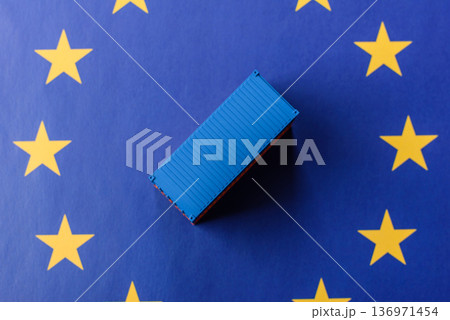 Cargo containers on the EU flag as a conceptual backdrop. Cargo containers on the EU flag Cargo containers on the EU flag as a conceptual backdrop. Cargo containers on the EU flag 136971454
