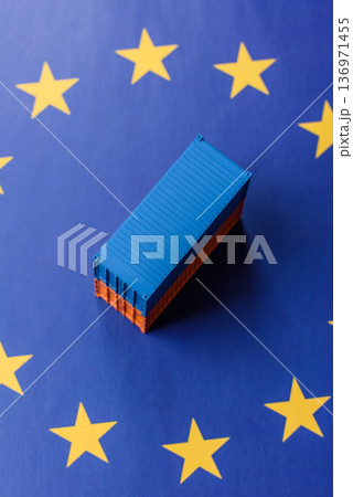 Cargo containers on the EU flag as a conceptual backdrop. Cargo containers on the EU flag 136971455