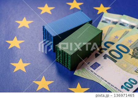 Cargo containers on the EU flag as a conceptual backdrop. Cargo containers on the EU flag 136971465
