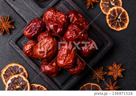 Red dried dates, the Chinese sweet fruit jujube, as a healthy food. Red dates, jujube Red dried dates, the Chinese sweet fruit jujube, as a healthy food. Red dates, jujube 136971528