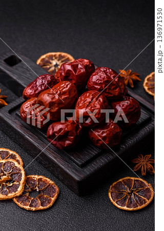 Red dried dates, the Chinese sweet fruit jujube, as a healthy food. Red dates, jujube Red dried dates, the Chinese sweet fruit jujube, as a healthy food. Red dates, jujube 136971530