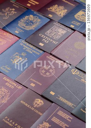 Passports of citizens of different countries of the world. Passports background Passports of citizens of different countries of the world. Passports background 136971609
