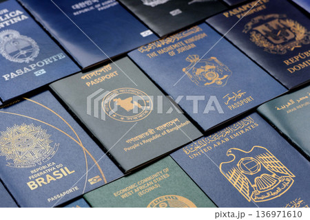 Passports of citizens of different countries of the world. Passports background Passports of citizens of different countries of the world. Passports background 136971610