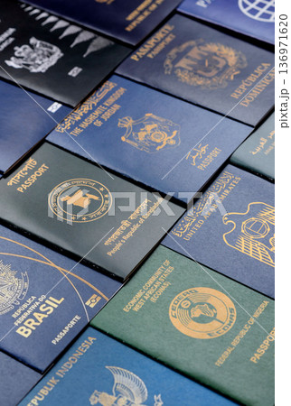 Passports of citizens of different countries of the world. Passports background Passports of citizens of different countries of the world. Passports background 136971620