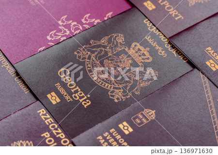 Passports of citizens of different countries of the world. Passports background Passports of citizens of different countries of the world. Passports background 136971630
