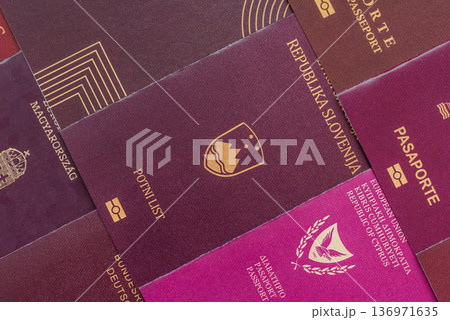 Passports of citizens of different countries of the world. Passports background Passports of citizens of different countries of the world. Passports background 136971635