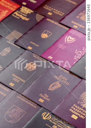 Passports of citizens of different countries of the world. Passports background Passports of citizens of different countries of the world. Passports background 136971648