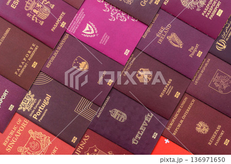 Passports of citizens of different countries of the world. Passports background Passports of citizens of different countries of the world. Passports background 136971650
