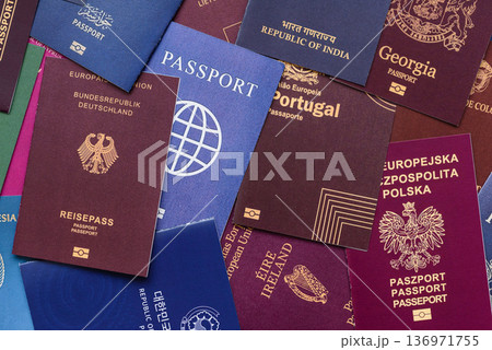 Passports of citizens of different countries of the world. Passports background Passports of citizens of different countries of the world. Passports background 136971755