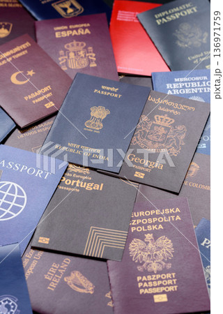 Passports of citizens of different countries of the world. Passports background 136971759