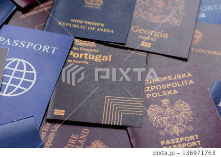 Passports of citizens of different countries of the world. Passports background Passports of citizens of different countries of the world. Passports background 136971763