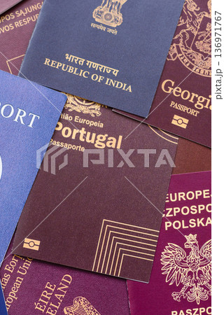 Passports of citizens of different countries of the world. Passports background Passports of citizens of different countries of the world. Passports background 136971767