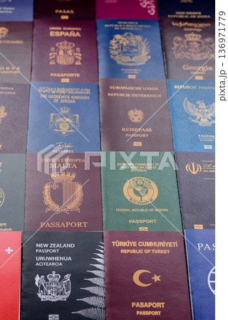 Passports of citizens of different countries of the world. Passports background Passports of citizens of different countries of the world. Passports background 136971779