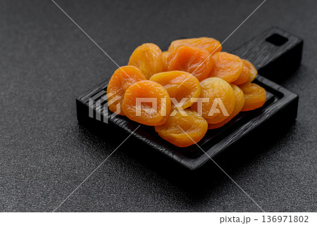 Dried apricots are a sweet, healthy fruit for vegans and vegetarians. Dried apricot Dried apricots are a sweet, healthy fruit for vegans and vegetarians. Dried apricot 136971802