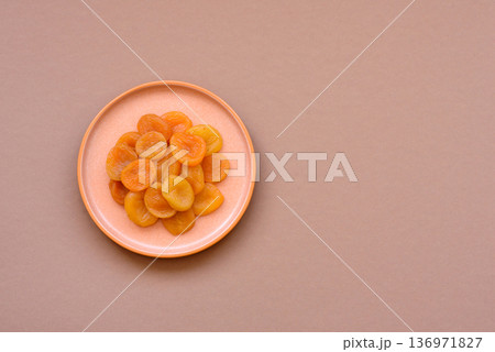 Dried apricots are a sweet, healthy fruit for vegans and vegetarians. Dried apricot Dried apricots are a sweet, healthy fruit for vegans and vegetarians. Dried apricot 136971827