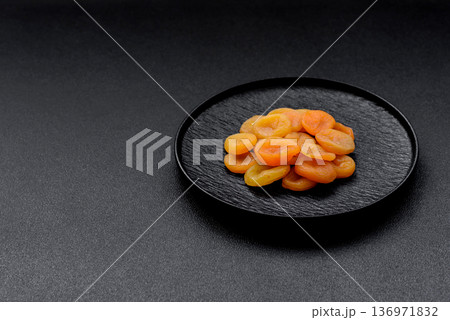 Dried apricots are a sweet, healthy fruit for vegans and vegetarians. Dried apricot Dried apricots are a sweet, healthy fruit for vegans and vegetarians. Dried apricot 136971832
