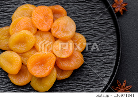 Dried apricots are a sweet, healthy fruit for vegans and vegetarians. Dried apricot Dried apricots are a sweet, healthy fruit for vegans and vegetarians. Dried apricot 136971841