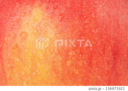 Texture of red apple with water drops macro photo as background. Texture of red apple with water drops macro photo as background. 136971921