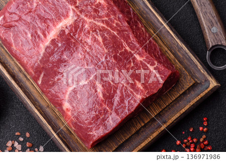 A piece of raw beef, a tenderloin for grilling or barbecue. Raw beef 136971986