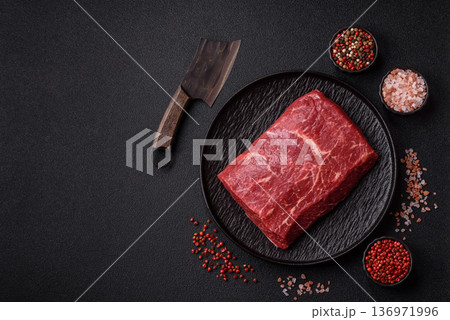 A piece of raw beef, a tenderloin for grilling or barbecue. Raw beef 136971996