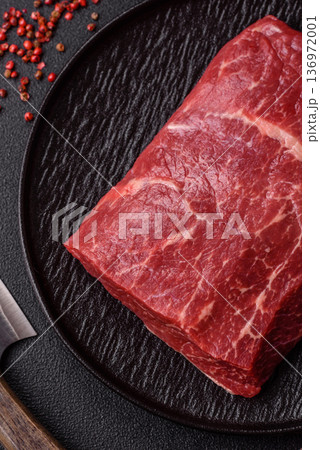 A piece of raw beef, a tenderloin for grilling or barbecue. Raw beef 136972001