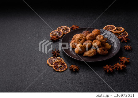 Dried fig are a sweet, healthy fruit for vegans and vegetarians. Dried fig as a food background 136972011