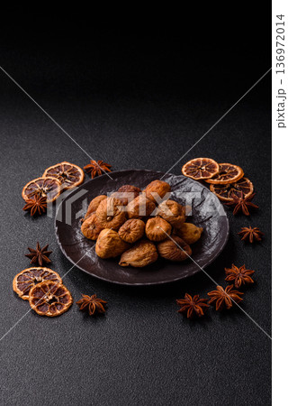 Dried fig are a sweet, healthy fruit for vegans and vegetarians. Dried fig as a food background 136972014