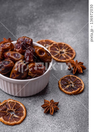 Dried sweet dates, natural tropical fruits for a healthy diet. Dried dates Dried sweet dates, natural tropical fruits for a healthy diet. Dried dates 136972030