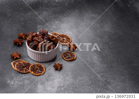 Dried sweet dates, natural tropical fruits for a healthy diet. Dried dates Dried sweet dates, natural tropical fruits for a healthy diet. Dried dates 136972031
