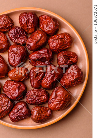 Red dried dates, the Chinese sweet fruit jujube, as a healthy food. Red dates, jujube Red dried dates, the Chinese sweet fruit jujube, as a healthy food. Red dates, jujube 136972071