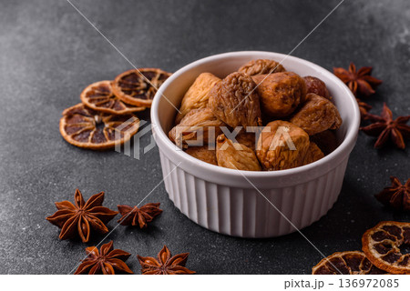 Dried fig are a sweet, healthy fruit for vegans and vegetarians. Dried fig as a food background Dried fig are a sweet, healthy fruit for vegans and vegetarians. Dried fig as a food background 136972085