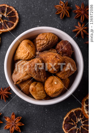 Dried fig are a sweet, healthy fruit for vegans and vegetarians. Dried fig as a food background Dried fig are a sweet, healthy fruit for vegans and vegetarians. Dried fig as a food background 136972086