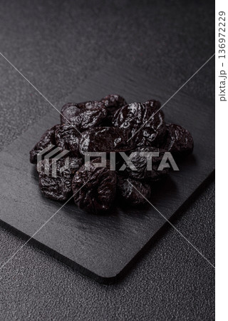 Sweet dried plums or prunes, organic dehydrated fruit for dietary nutrition. Prunes or dried plums Sweet dried plums or prunes, organic dehydrated fruit for dietary nutrition. Prunes or dried plums 136972229