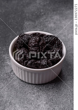Sweet dried plums or prunes, organic dehydrated fruit for dietary nutrition. Prunes or dried plums Sweet dried plums or prunes, organic dehydrated fruit for dietary nutrition. Prunes or dried plums 136972271