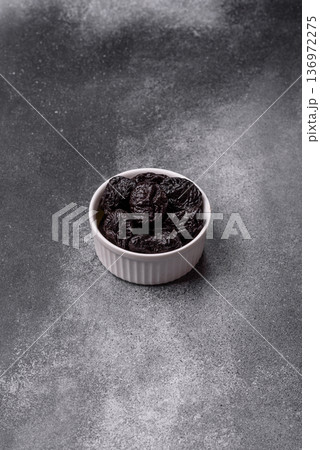Sweet dried plums or prunes, organic dehydrated fruit for dietary nutrition. Prunes or dried plums Sweet dried plums or prunes, organic dehydrated fruit for dietary nutrition. Prunes or dried plums 136972275