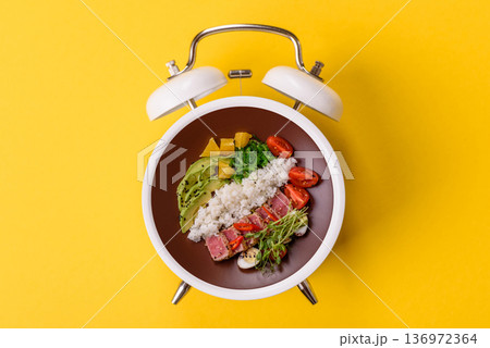 Seared tuna tataki in a bowl with sesame seeds, rice, and vegetables. Tuna tataki Seared tuna tataki in a bowl with sesame seeds, rice, and vegetables. Tuna tataki 136972364