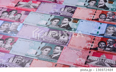 Dominican republic money, peso currency, banknotes of various denominations. Dominican money, peso Dominican republic money, peso currency, banknotes of various denominations. Dominican money, peso 136972484