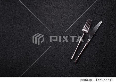 A knife and fork, silver kitchen utensils for the dining table. A knife and fork 136972741