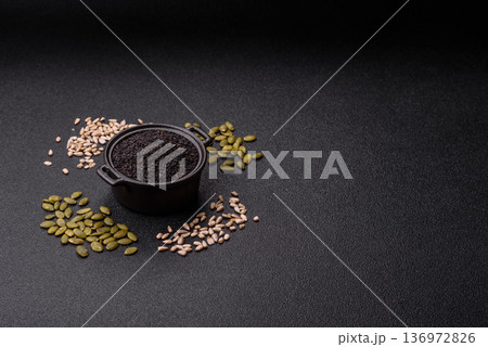 Black sesame seeds in a bowl, an ingredient for oil and healthy eating. Black sesame 136972826