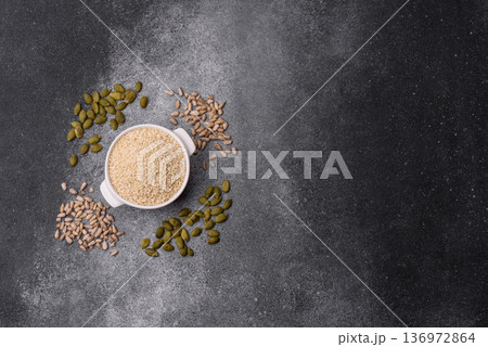 White sesame seeds in a bowl, an ingredient for oil and healthy eating. White sesame 136972864
