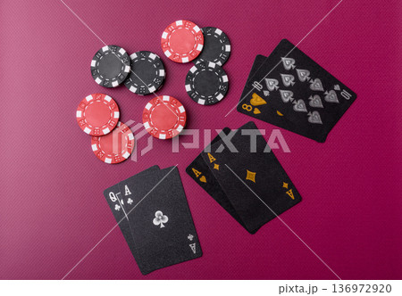 Casino, cards and chips on a colored background, poker and blackjack, gambling. Cards and chips Casino, cards and chips on a colored background, poker and blackjack, gambling. Cards and chips 136972920